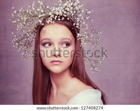 spring portrait  girl with wreath of flowers