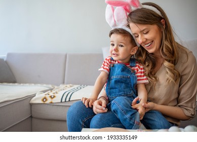 Spring portrait of mother and son on Easter's Day. Happy young mother having fun with her child. Family lifestyle, motherhood, love and tender moments concept - Shutterstock ID 1933335149