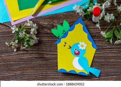 Spring Postcard Birdhouse With A Bird On A Wooden Table. Handmade. Project Of Children's Creativity, Handicrafts, Crafts For Kids.