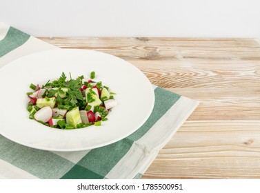 Spring Radish Salad On Wooden Backgrouns. Simple Green Rustic Salat With Sliced Radishes And Cucumbers