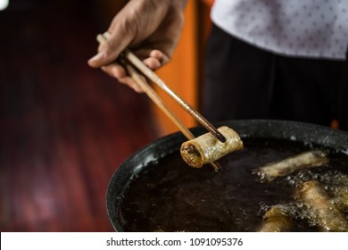 Spring Roll In Vietnam Holding Sticks