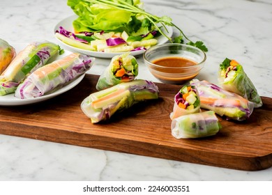 Spring rolls or egg rolls. Spring rolls are rolled appetizers or dim sum found in Chinese and other Southeast Asian cuisines. Rice paper filled with vegetables, meats, spices and served with sauces. - Powered by Shutterstock