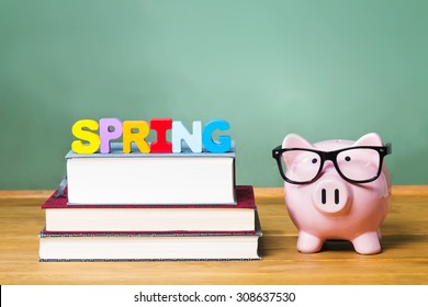 Spring Semester Theme With Textbooks And Piggy Bank And Green Chalkboard