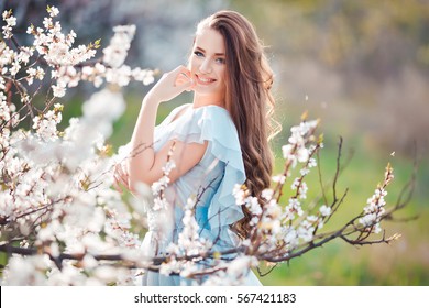 Spring Smile. Happy Beautiful Smiling Young Woman In Blossom Park.