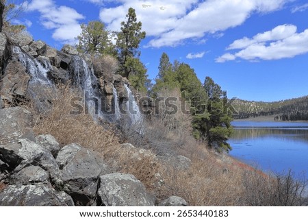 spring snow melt making waterfall in Greer lakes, Arizona