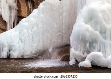 Spring, Snow On The Banks Of A Mountain River, Forest And Mountains, Snow Melting.