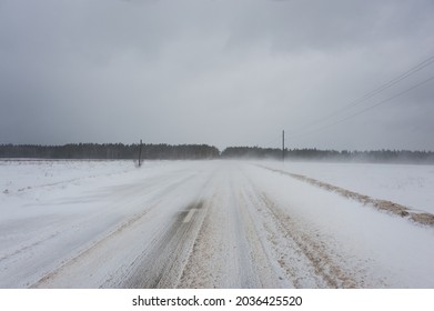 Spring Snowstorm In The Field And On The Road.