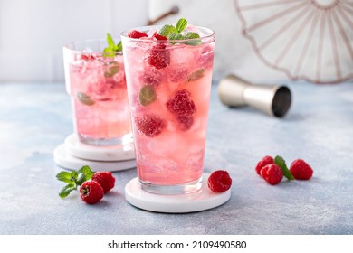Spring or summer cold refreshing cocktail or mocktail with raspberry and mint - Shutterstock ID 2109490580