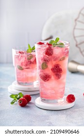 Spring or summer cold refreshing cocktail or mocktail with raspberry and mint - Shutterstock ID 2109490646
