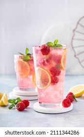 Spring or summer refreshing cold cocktail or mocktail with berries and lemon, raspberry lemonade - Shutterstock ID 2111344286