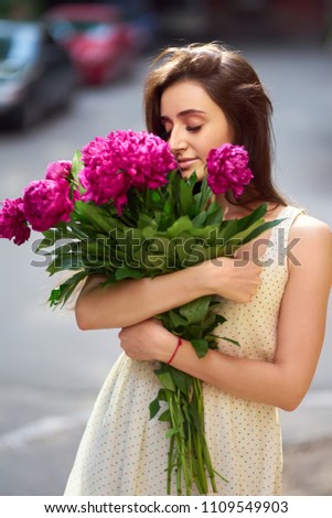 Similar – Woman arranges luxury bouquet of flowers