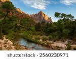 Spring sunset over The Watchman and the Virgin River in Zion National Park, Springdale, Utah, USA.