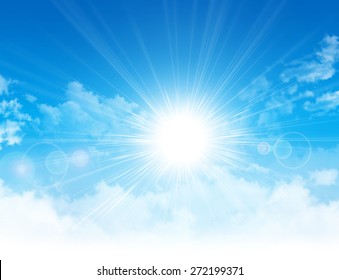 Spring sunshine. Sun light breaking through white clouds in blue sky