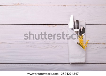 Spring table setting with mimosa. Holidays background with copy space