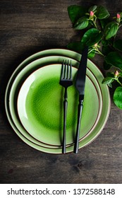 Spring table setting in rustic style decorated with cherry bloom tree branches