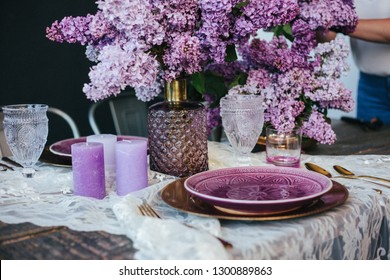 Spring Time Table Setting With Lilac Flowers And Vintage Plates And Silverware On Rustic Wooden Table. Beautiful Table Setting With Silver Cutlery And Lilac As Floral Decor. Spring Elegant Table Place