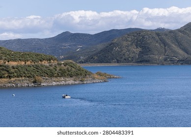 Spring time view of lush foliage framing the Diamond Valley Lake of Hemet, California, USA.