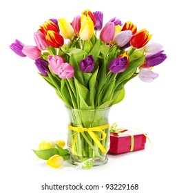 spring tulips with easter eggs  on white background