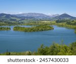 Spring in the Urkulu reservoir. Urkulu reservoir with Orixol mountain in the background, Euskadi