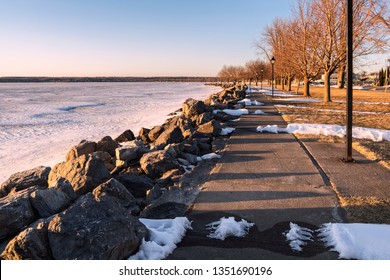 Spring View of Sylvan Beach Shoreline on Oneida Lake during Sunset while the Lake is Still Frozen.