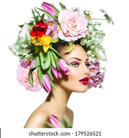 Spring Woman. Beauty Girl With Flowers Hair Style. Beautiful Model Woman With Blooming Flowers On Her Head. Nature Hairstyle. Summer. Holiday Creative Makeover. Fashion Makeup. Make Up. Vogue Style 