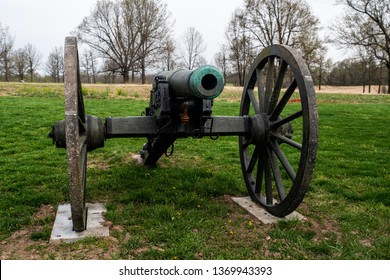 Springfield, MO—April 11, 2019; Bronze Barrel Of Muzzle Loaded Civil War Cannon With Wooden Wheels Sits In Field At Wilsons Creek National Battlefield In Southwest Missouri