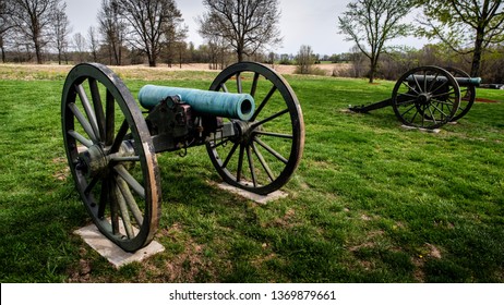 Springfield, MO—April 11, 2019; Two Civil War Era Bronze Muzzle Loaded Cannons With Wooden Carriages And Wheels Stand In Field At Wilsons Creek National Battlefield In Southwest Missouri.