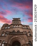 Springfield Historic City Hall, built in 1891, at Government Plaza in Greene County, Missouri, USA: A three-story, L-shaped, Romanesque Revival style limestone block building