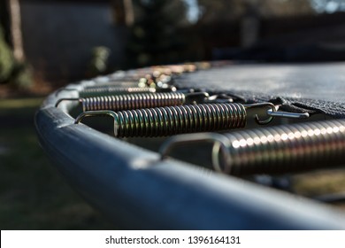 springs attached to the trampoline frame, activity background