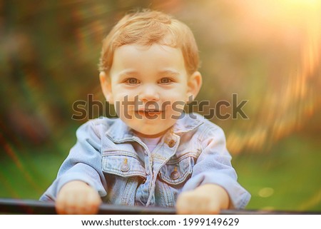 Similar – Image, Stock Photo Little cute boy looking at camera and sticking out his tongue