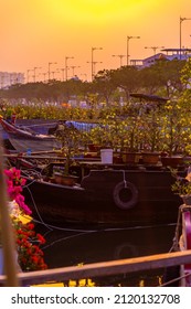 Springtime in Saigon, boat on canal, transport spring flower for Tet to Ben Binh Dong open air market, Vietnamese happy with Lunar New Year, Vietnam. Tet holiday in Vietnam.