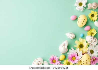 Springtime splendor: Easter's bloom. Top view shot of delightful collection of Easter eggs, white and pink blooms, playful bunny figurines on turquoise background with space for festive announcements