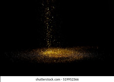 Sprinkle Gold Dust On A Black Background With Copy Space.