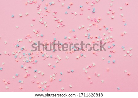 sprinkles background, sugar sprinkle butterflies, decoration for cake and bakery. Top view, flat lay. pastel colors
