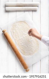 Sprinkling A Strudel Dough With Maize Flour To Prevent Sticking