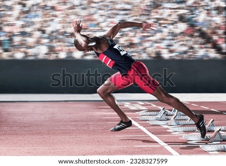 Sprinter taking off from starting block on track