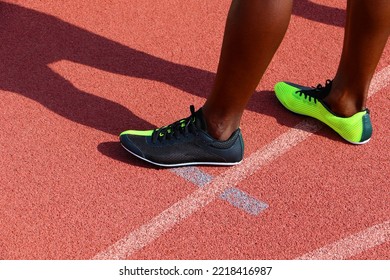 Sprinters Feet Wearing Runners Shoes Standing On An Athletics Track