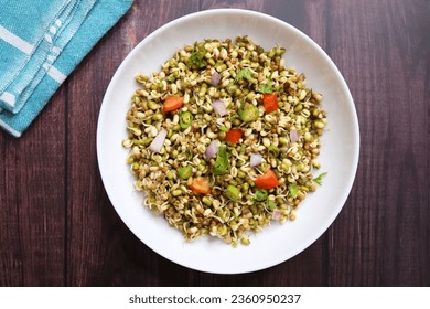 Sprouted moong beans. Protine rich salad. Healthy snack items. Sprouted Lentil Salad. Mixed with Onion, tomatoes, green chili and coriander. Copy space. Sprout Bhel. - Powered by Shutterstock