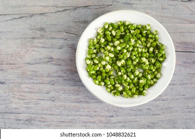Sprouted mung beans. Sprouted mung beans on white plate. Mung beans sprouts background. Bean sprouts. Green radiata vigna.