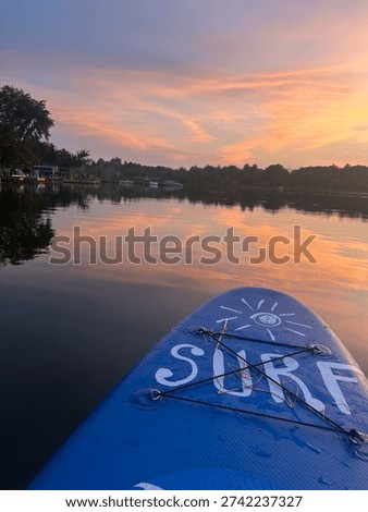 Spry lake sunset while paddle boarding