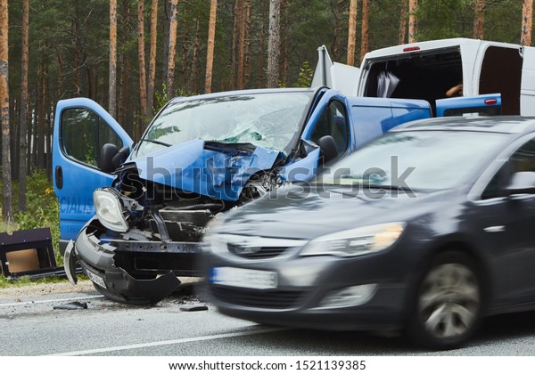 Spunciems,\
Latvia, August 29, 2019: van after accident on a road because of\
frontal collision, transportation\
background