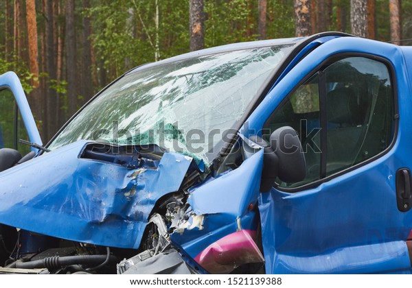 Spunciems,\
Latvia, August 29, 2019: van after accident on a road because of\
frontal collision, transportation\
background
