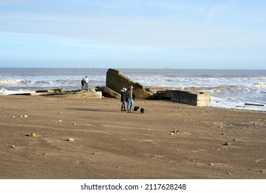 Spurn Head, Yorkshire, UK 01 30 2022 Dog Walkers On A Beach