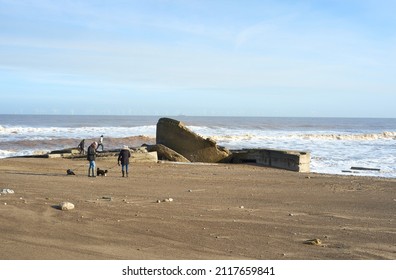 Spurn Head, Yorkshire, UK 01 30 2022 Dog Walkers On A Beach