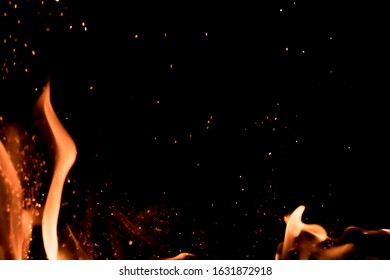 Spurts of flame with sparks on a perfect black background. Great for overlay usage.