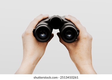 Spy holding binoculars, isolated on white