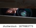 Spy Man. Peeping. Spying. Surveillance. Secret Information. Hidden Camera. Man hiding. Paparazzi. Stalker. Private Detective. Spy Camera. Spy Detective. Espionage. Privacy. Information. Investigation