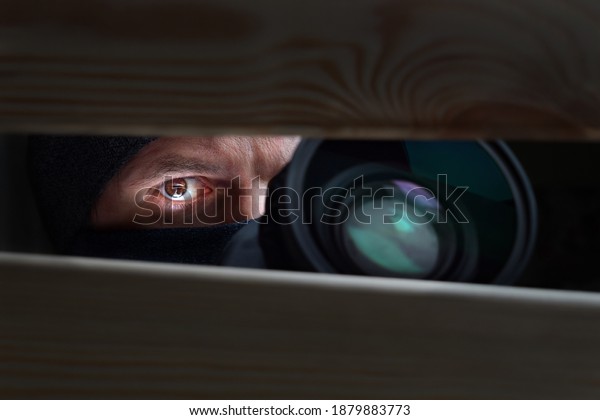 Spy Man. Peeping. Spying. Surveillance.\
Secret Information. Hidden Camera. Man hiding. Paparazzi. Stalker.\
Private Detective. Spy Camera. Spy Detective. Espionage. Privacy.\
Information. Investigation