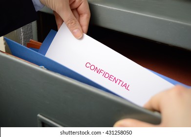 Spy Stealing Confidential Files In An Office