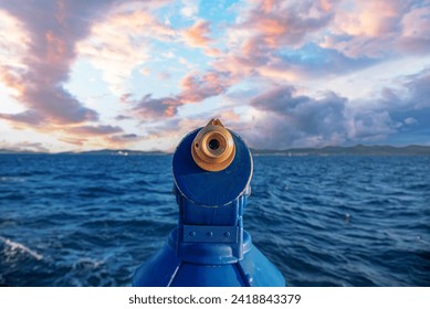 Spyglass on the seashore. Panorama of binoculars and ocean in the background. - Powered by Shutterstock